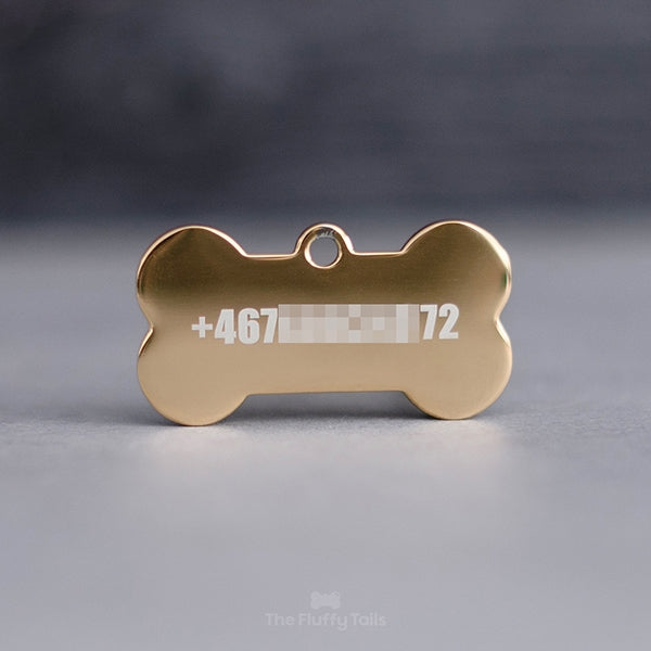 Hundbensformad, guldig namnbricka med telefonnummer som har lasergraverats