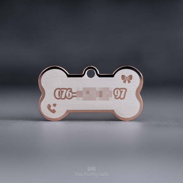 Hundbensformad ID-bricka i roséguld med personlig gravyr och design, telefonnummer och ikon på rosett och telefon med hjärta