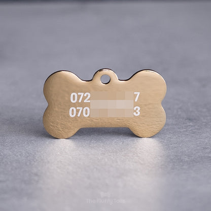 Hundbensformad guldig namnbricka, graverad med två telefonnummer