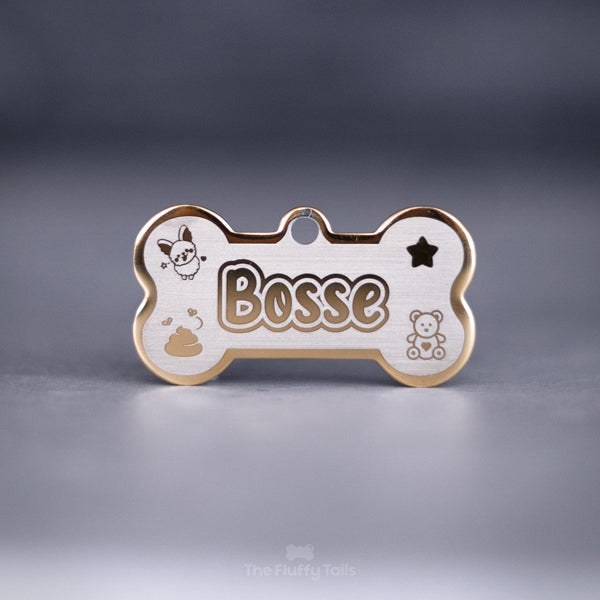 Guldig id-bricka i hundbensform av rostfritt stål med egen design och personlig gravyr med hundens namn
