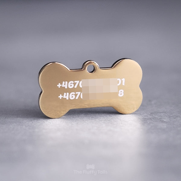 Hundbensformad guldig namnbricka, graverad med två telefonnummer, passar både hundar och katter