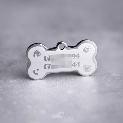 Silvrig hundbensformad namntag, id-bricka, namnbricka av rostfritt stål med egen design och personlig gravyr. Namnbrickan är lasergraverad med två telefonnummer till husse och matte samt ikoner på ett hus, måne med hjärta och glitter, telefonlur med hjärta och en igloo-koja. Passar även katter.