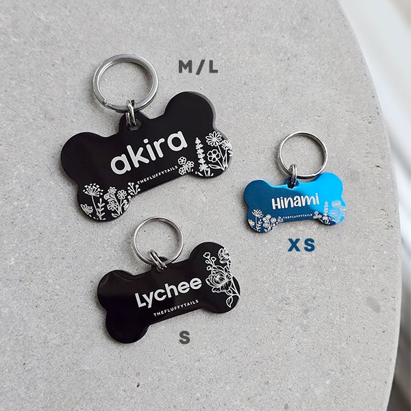 Namnbrickor av rostfritt stål ur sommarkollektionen med somriga designer i tre olika storlekar